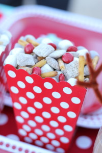 Christmas Snack Mix in a red and white polka dot popcorn box