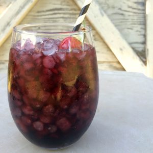 homemade cherry wine cooler served over ice