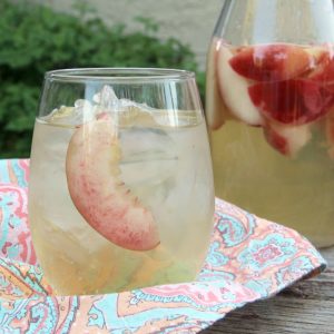 Sip on this refreshing PEACH SANGRIA all summer long. Only 4 simple ingredients and tons of peachy goodness!