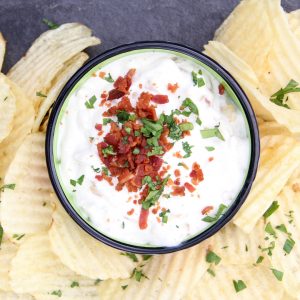 Take plain French Onion Dip from good to great when you add bacon. This French Onion & Bacon Dip will blow your mind.