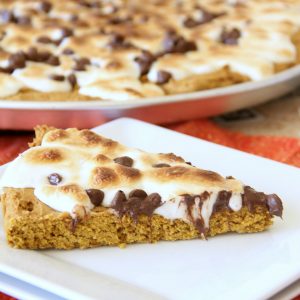 Fall is here and this Pumpkin S'Mores Pizza is scrumptious and the perfect fall dessert! It's such an easy recipe and takes only about 3o minutes!