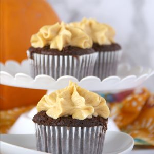 Fall has never tasted so good! Once you try one of these dreamy Chocolate Cupcakes with Pumpkin Buttercream Frosting you'll be reachin' for a second one.