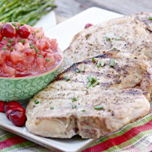 Pork Chops are great year round on the grill with just some simple seasonings, but making these Grilled Pork Chops with Cranberry Applesauce takes supper to a whole new level and turns it into a delicious holiday meal.