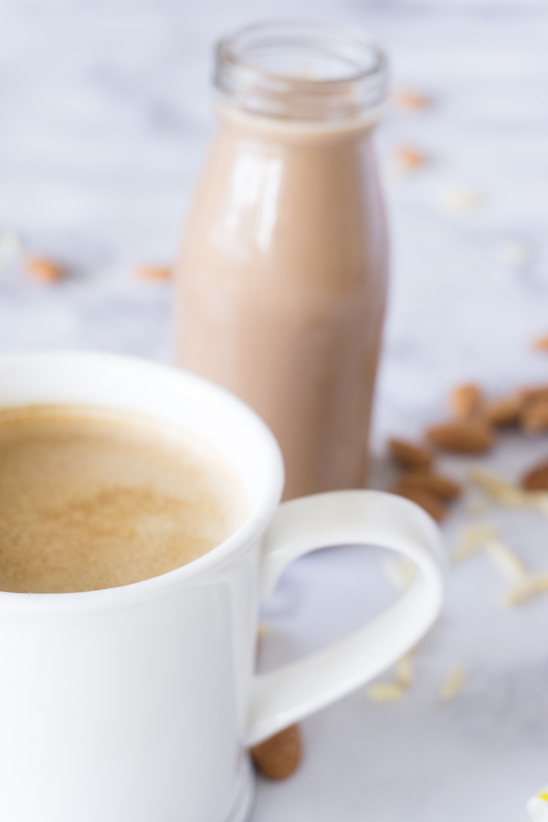 Splurge a little with this thick and creamy dairy free Almond Joy Coffee Creamer.  It's made completely from scratch and just a few basic ingredients like almonds, cocoa powder, sugar, and extracts.